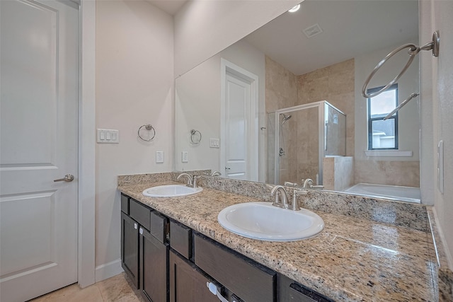 9027 Laverne Cres, Houston, TX 77080 - full bathroom featuring a shower stall, double vanity, a garden tub, and tile patterned flooring