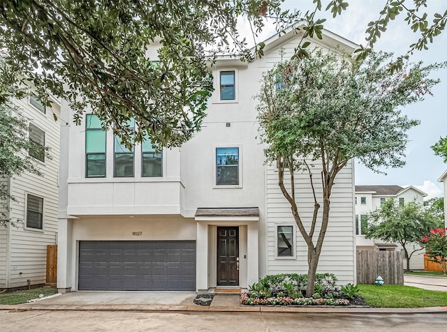 9027 Laverne Cres, Houston, TX 77080 - view of front of house with stucco siding, concrete driveway, and an attached garage