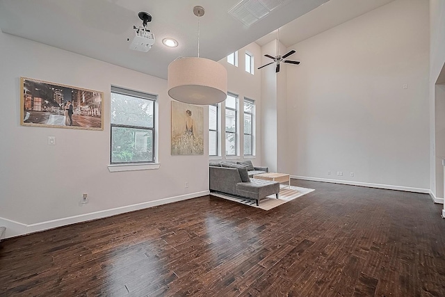 9027 Laverne Cres, Houston, TX 77080 - unfurnished living room featuring wood finished floors, ceiling fan, and vaulted ceiling