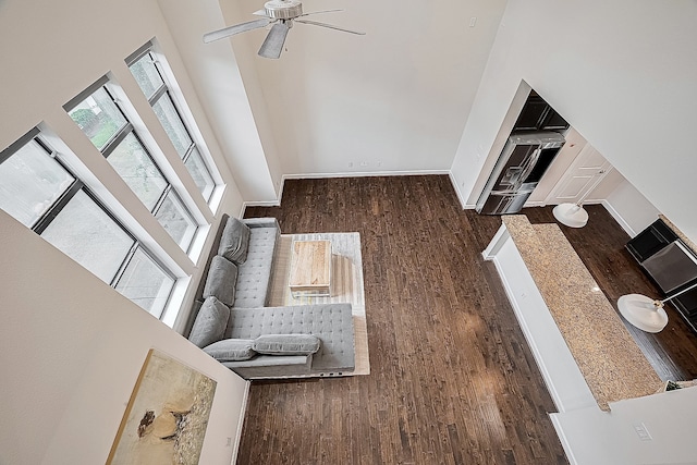 9027 Laverne Cres, Houston, TX 77080 - living area with wood finished floors, ceiling fan, and a high ceiling