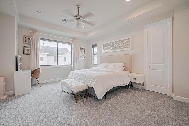 9027 Laverne Cres, Houston, TX 77080 - carpeted bedroom with a tray ceiling, a ceiling fan, and recessed lighting