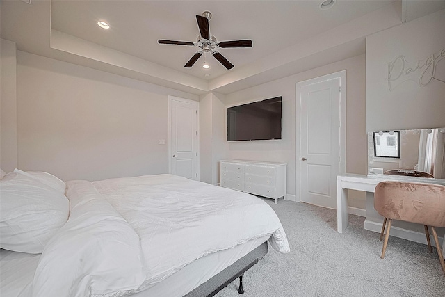 9027 Laverne Cres, Houston, TX 77080 - bedroom with light colored carpet, a raised ceiling, recessed lighting, and ceiling fan