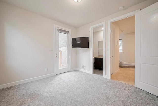 9027 Laverne Cres, Houston, TX 77080 - unfurnished bedroom with light carpet, access to outside, and connected bathroom