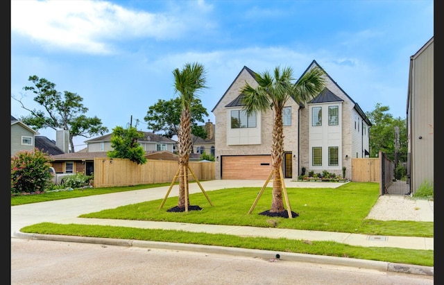3909 Ella Blvd, Houston, TX 77018 - view of front facade with driveway, a gate, a garage, and brick siding