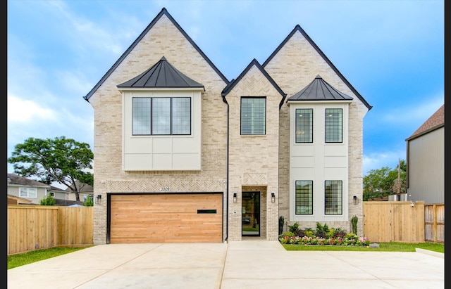3909 Ella Blvd, Houston, TX 77018 - view of front facade with brick siding and a standing seam roof