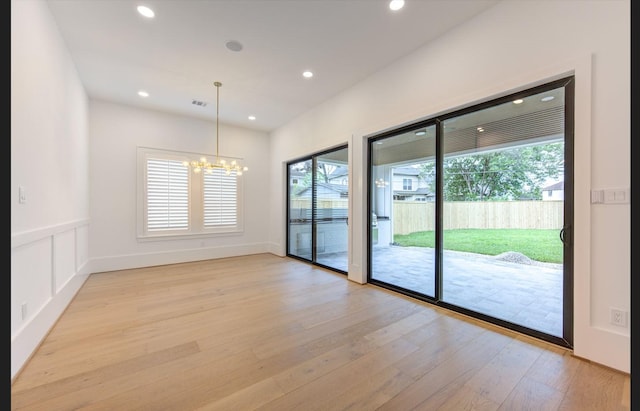 3909 Ella Blvd, Houston, TX 77018 - spare room with plenty of natural light, a chandelier, light wood-style flooring, and recessed lighting