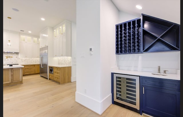 3909 Ella Blvd, Houston, TX 77018 - indoor bar with wine cooler, backsplash, light wood-style floors, recessed lighting, and high quality fridge