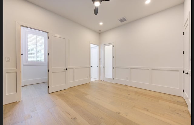 3909 Ella Blvd, Houston, TX 77018 - unfurnished bedroom with light wood finished floors, a decorative wall, recessed lighting, ceiling fan, and a wainscoted wall