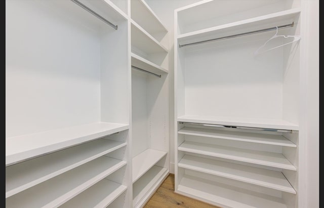 3909 Ella Blvd, Houston, TX 77018 - walk in closet with light wood-type flooring