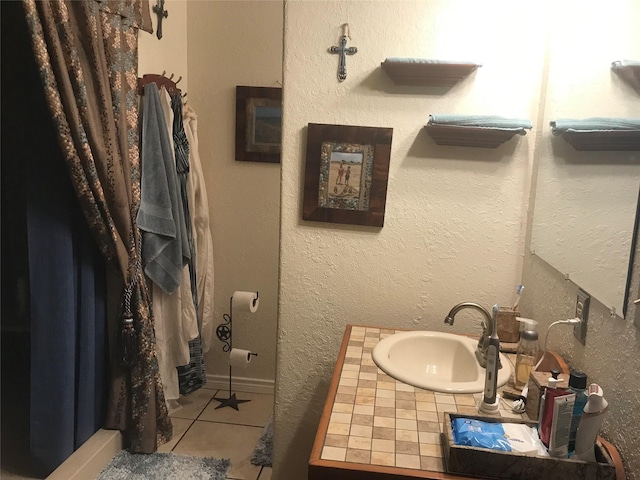 bathroom with sink and tile flooring