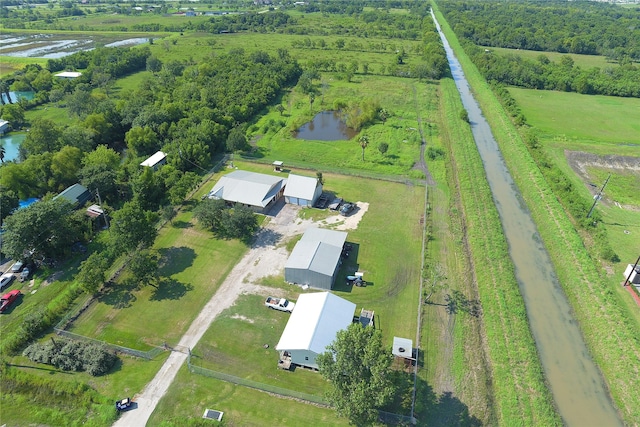 aerial view with a rural view and a water view