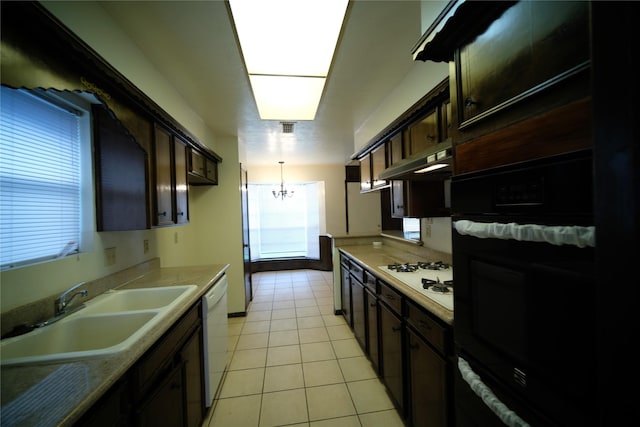 kitchen featuring a chandelier, decorative light fixtures, light tile floors, white appliances, and dark brown cabinets