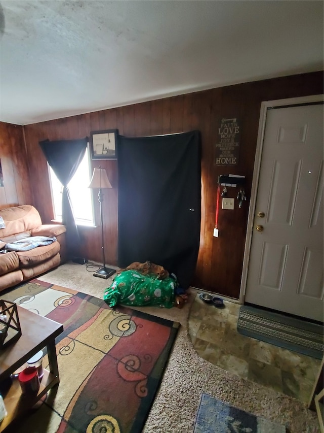 living room featuring wood walls