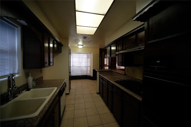 kitchen featuring light tile flooring, dark brown cabinetry, dishwasher, and sink