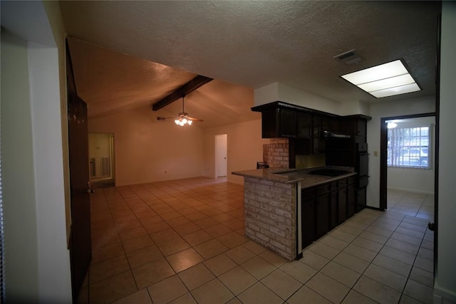 kitchen with black electric stovetop, ceiling fan, light tile flooring, and lofted ceiling with beams