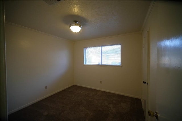 carpeted empty room featuring crown molding