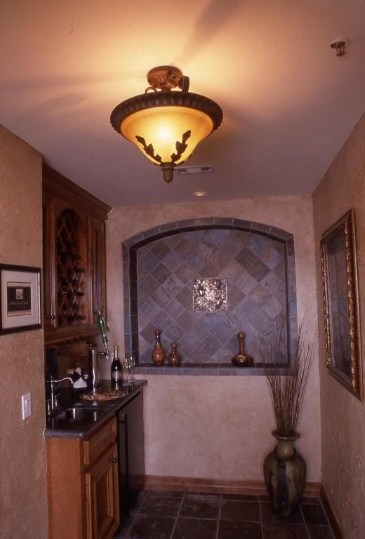 kitchen featuring dark tile flooring