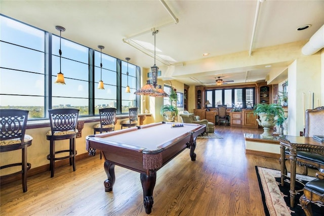 recreation room with ceiling fan, pool table, indoor bar, and hardwood / wood-style flooring