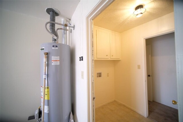 utility room featuring gas water heater