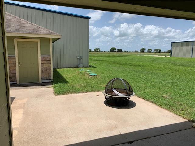 view of patio / terrace with a fire pit