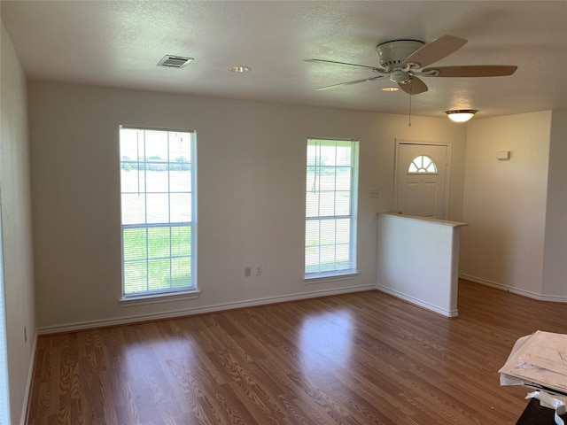 interior space featuring ceiling fan and hardwood / wood-style flooring