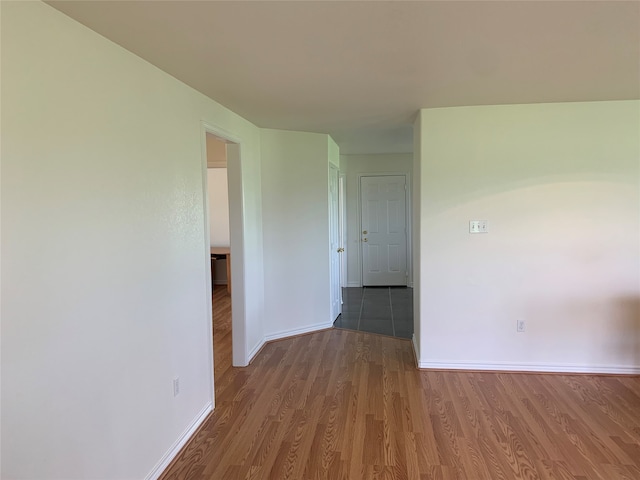 empty room with wood-type flooring