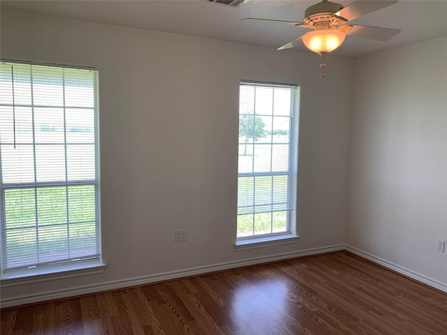 spare room with ceiling fan and hardwood / wood-style flooring