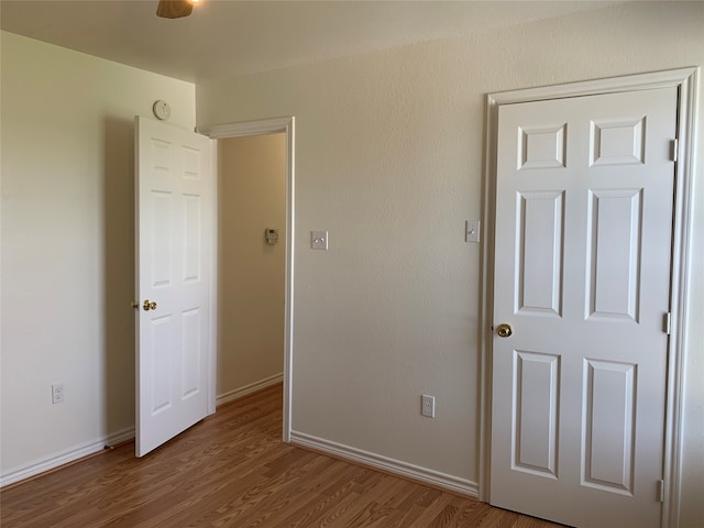 unfurnished bedroom featuring wood-type flooring