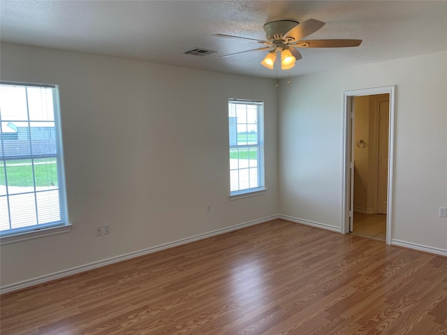 unfurnished room featuring wood-type flooring and ceiling fan