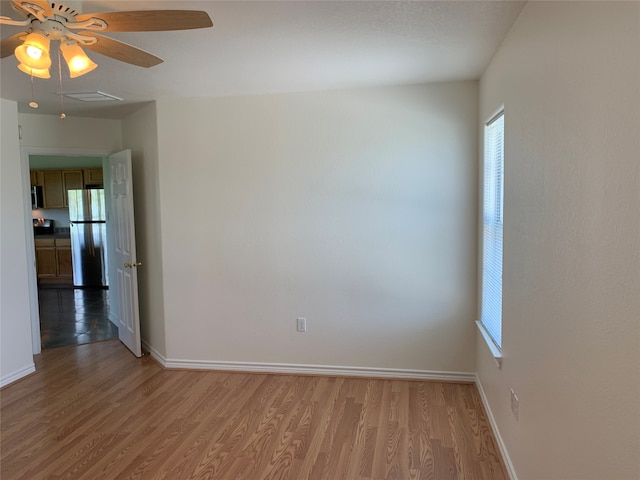 empty room featuring wood-type flooring and ceiling fan