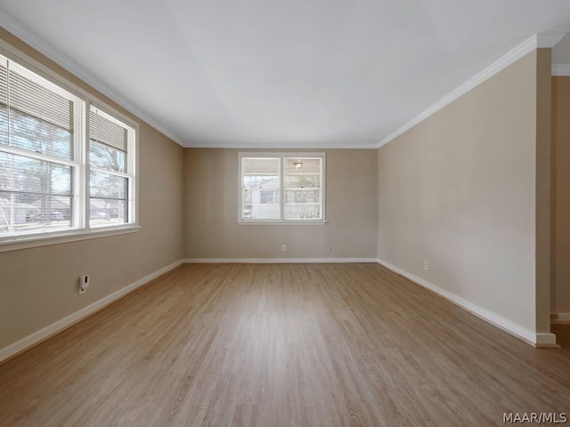 empty room featuring hardwood / wood-style floors and ornamental molding