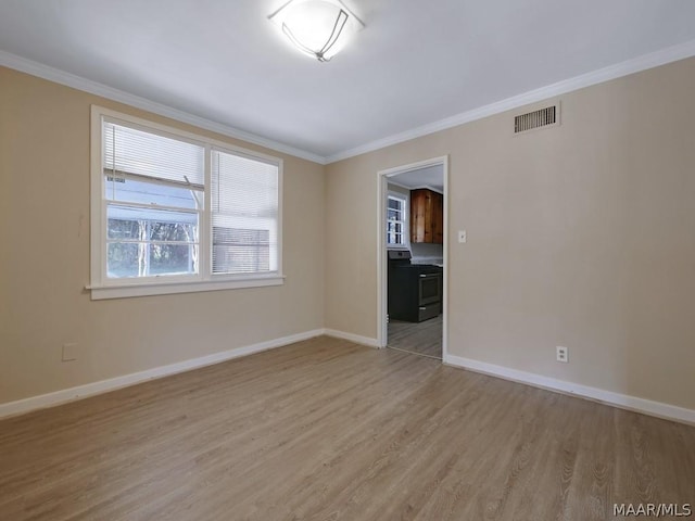 unfurnished room with crown molding and light wood-type flooring