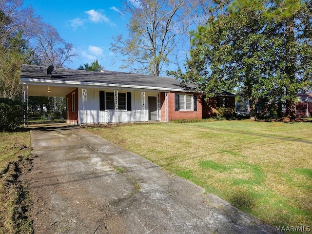 ranch-style home featuring a front yard and a carport