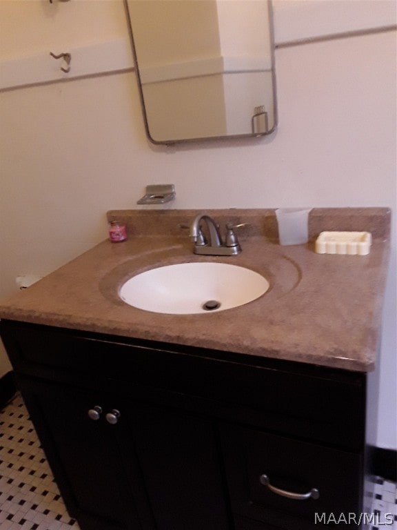 bathroom featuring vanity and tile flooring