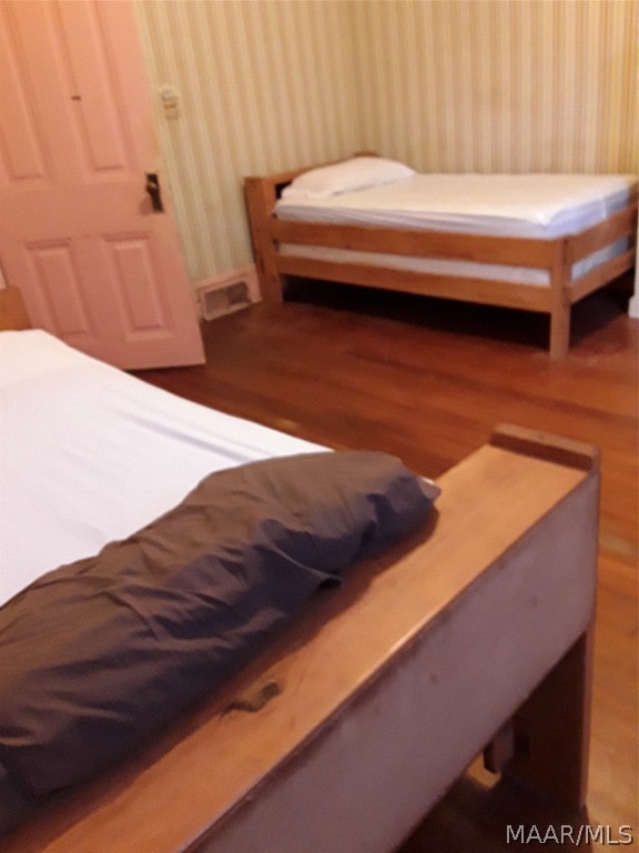 bedroom featuring hardwood / wood-style flooring