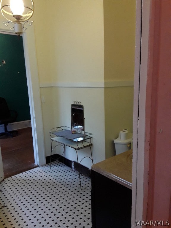 bathroom featuring toilet, hardwood / wood-style floors, and vanity