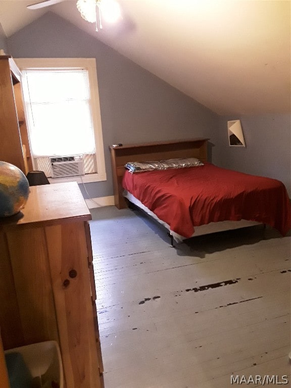 bedroom with vaulted ceiling, ceiling fan, and light wood-type flooring