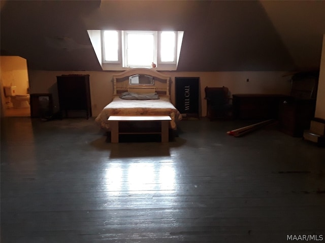 bedroom featuring dark hardwood / wood-style flooring