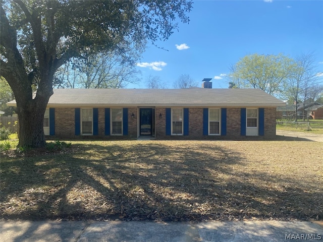 ranch-style home with a front yard