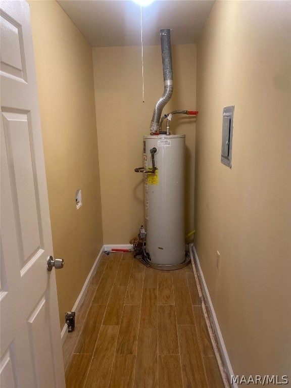 utility room featuring gas water heater