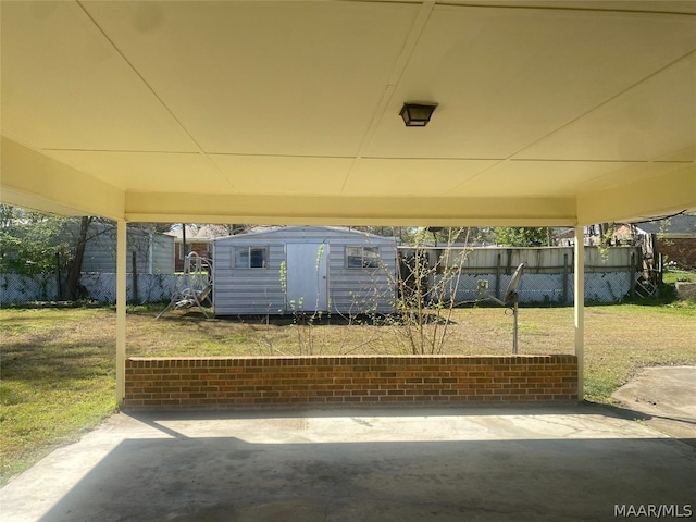 view of patio with a storage unit