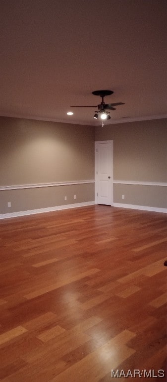 unfurnished room featuring hardwood / wood-style floors and ceiling fan