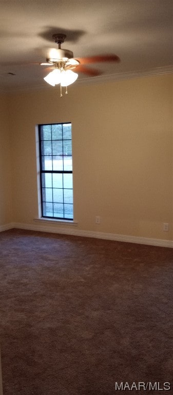 carpeted empty room with ornamental molding and ceiling fan