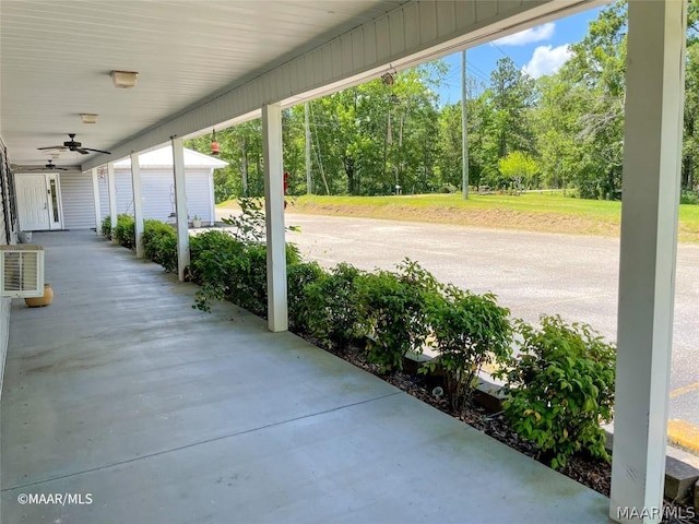 view of patio featuring ceiling fan