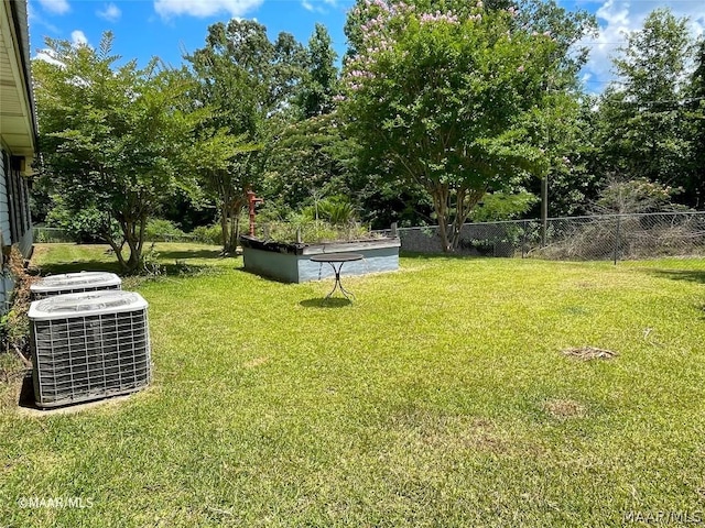 view of yard featuring central AC unit