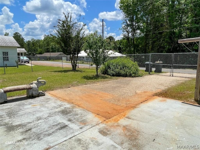 exterior space featuring a yard and a patio area