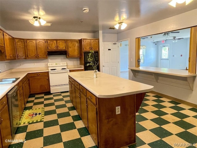 kitchen featuring electric range, light tile flooring, a kitchen island with sink, sink, and stainless steel dishwasher