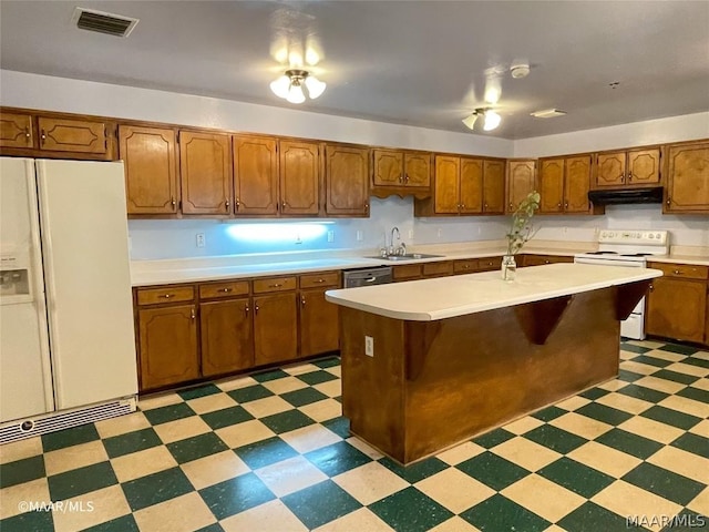 kitchen with an island with sink, white appliances, sink, light tile floors, and ventilation hood