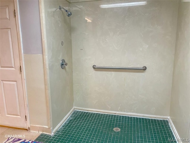 bathroom with walk in shower and tile flooring