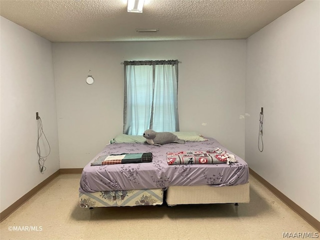 bedroom with a textured ceiling